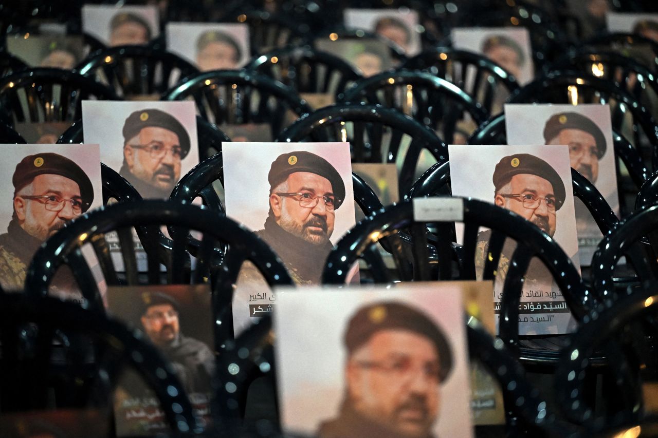 Pictures of Fu'ad Shukr are placed on chairs ahead of his funeral in Beirut on Thursday.