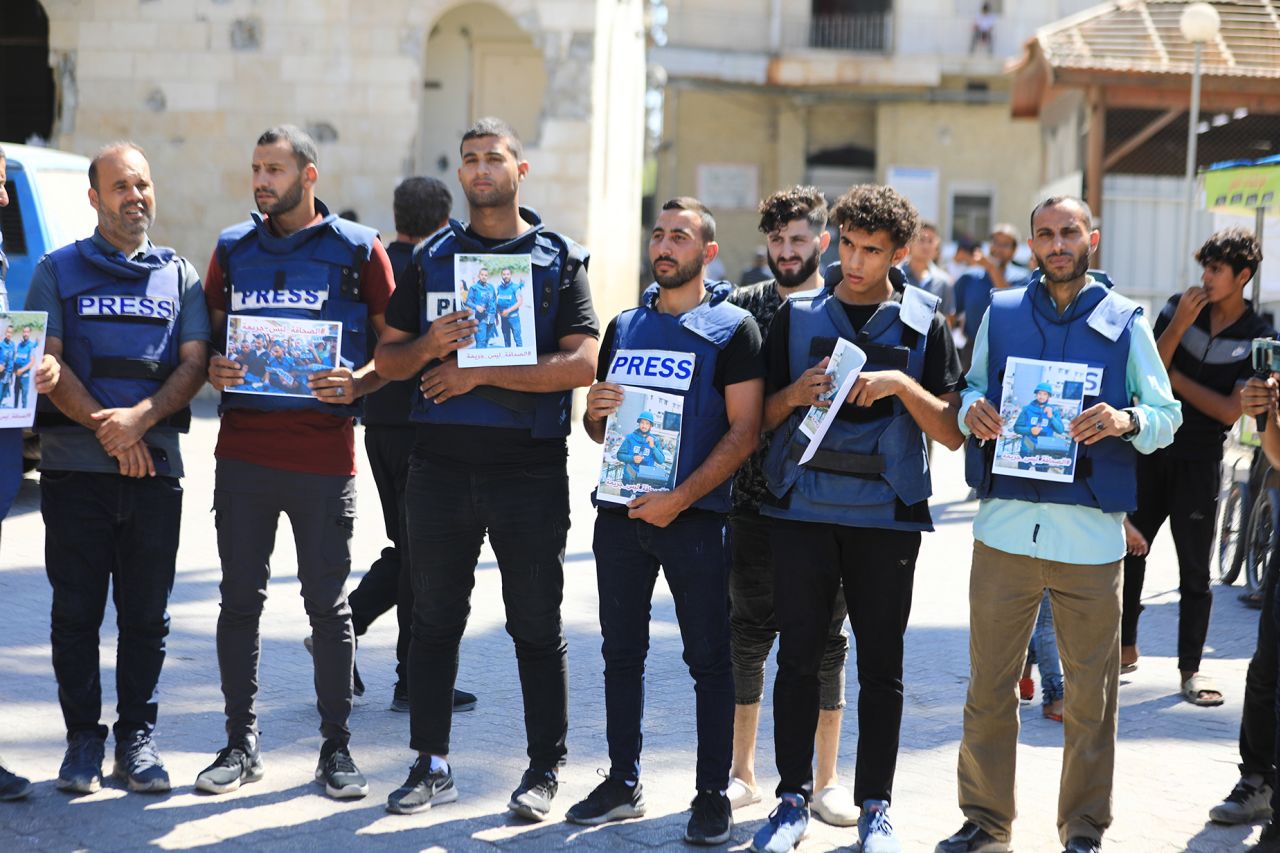 Dozens of journalists held press badges and pictures of their colleagues Ismail Al-Ghoul and Rami Al-Rifi who were killed in an airstrike earlier this week, during a protest in Gaza City, on Thursday.