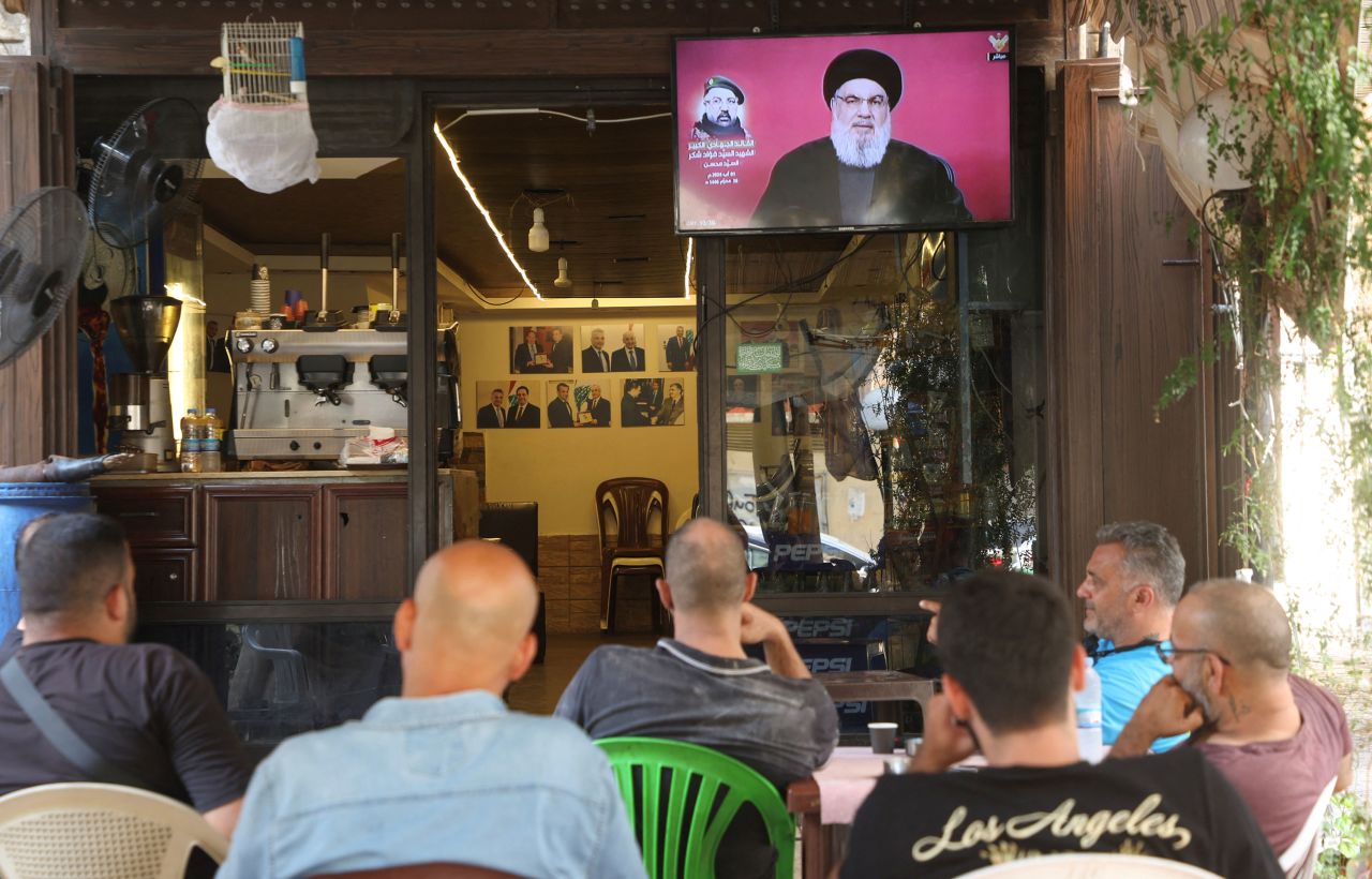 People watch from a cafe in Beirut a broadcast of Hezbollah chief Hassan Nasrallah speaking on Thursday.