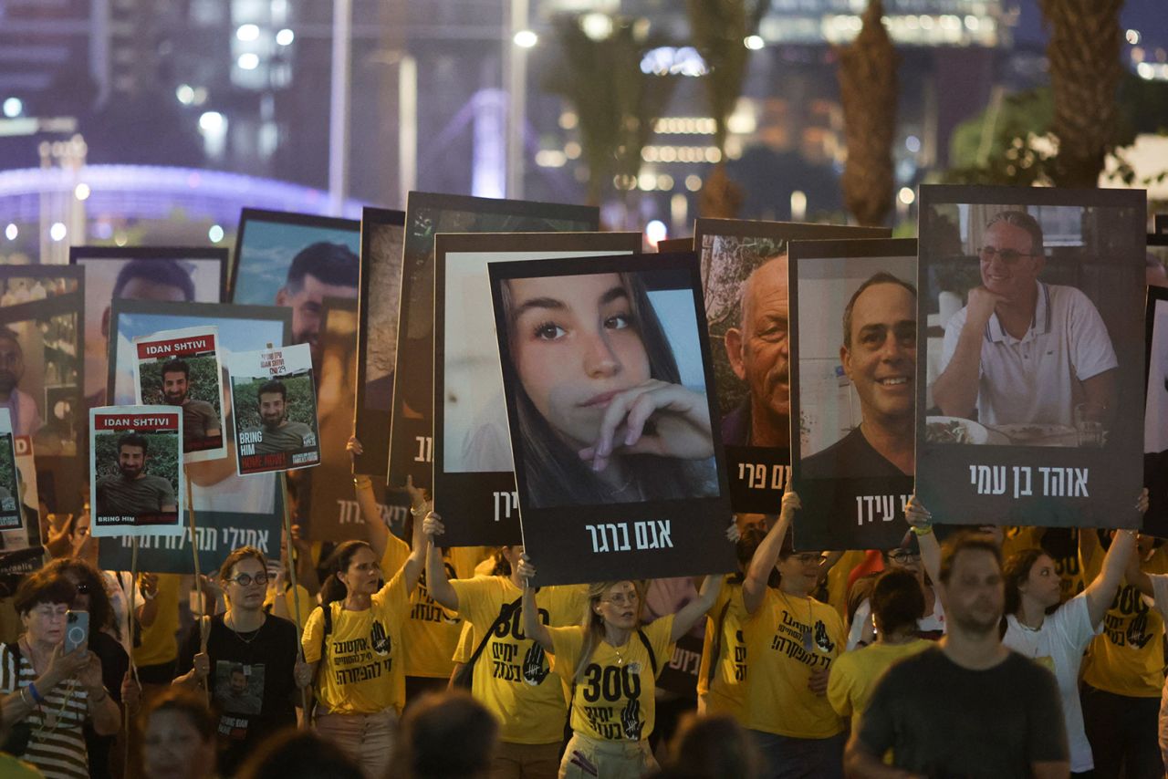 Israelis take part in a march marking 300 days since the deadly October 7 attack and calling for an immediate release of hostages being held in Gaza, in Tel Aviv, Israel, on August 1. 