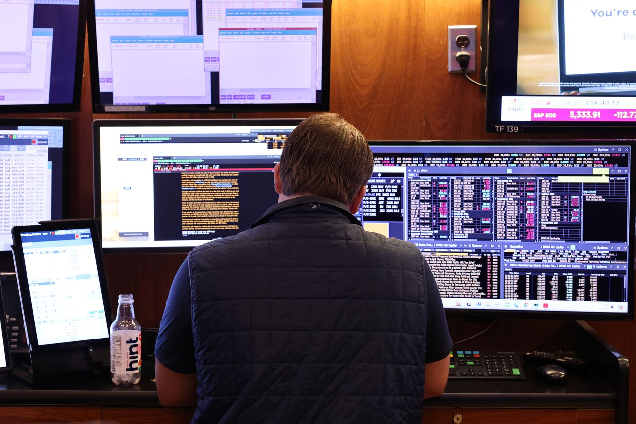 Traders work on the floor of the New York Stock Exchange during afternoon trading on August 2.