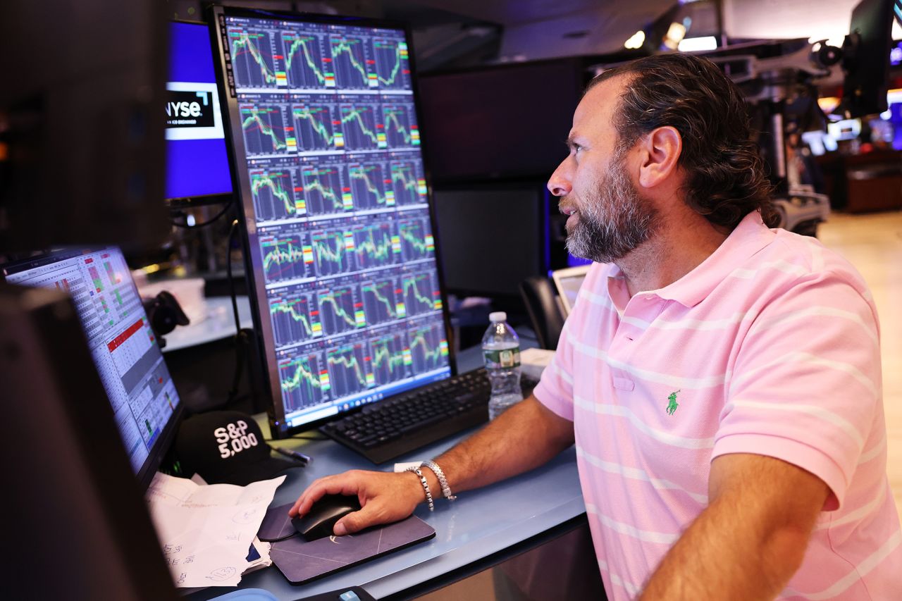 Traders work on the floor of the New York Stock Exchange during afternoon trading on August 2.