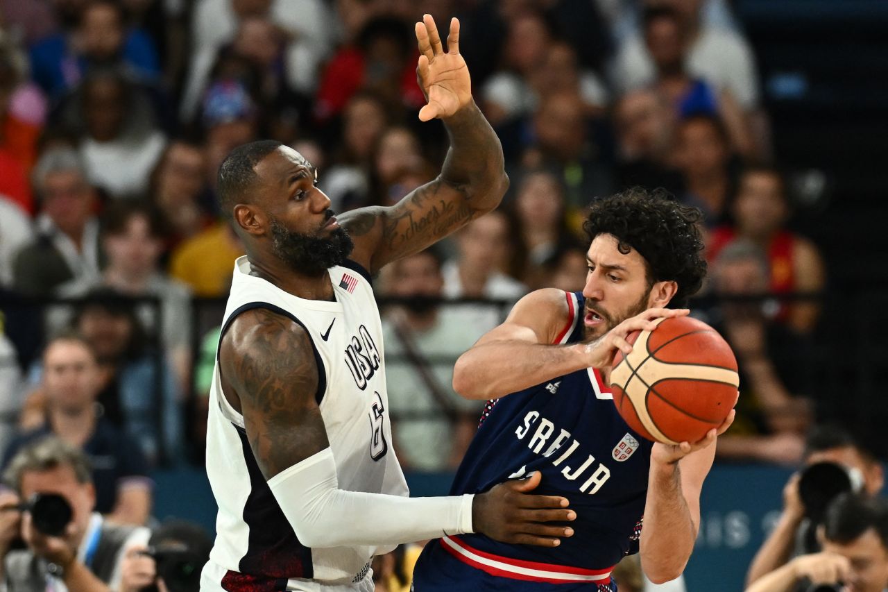 Serbia's Vasilije Micic challenges USA's LeBron James in the men's semifinal basketball at the Bercy Arena.