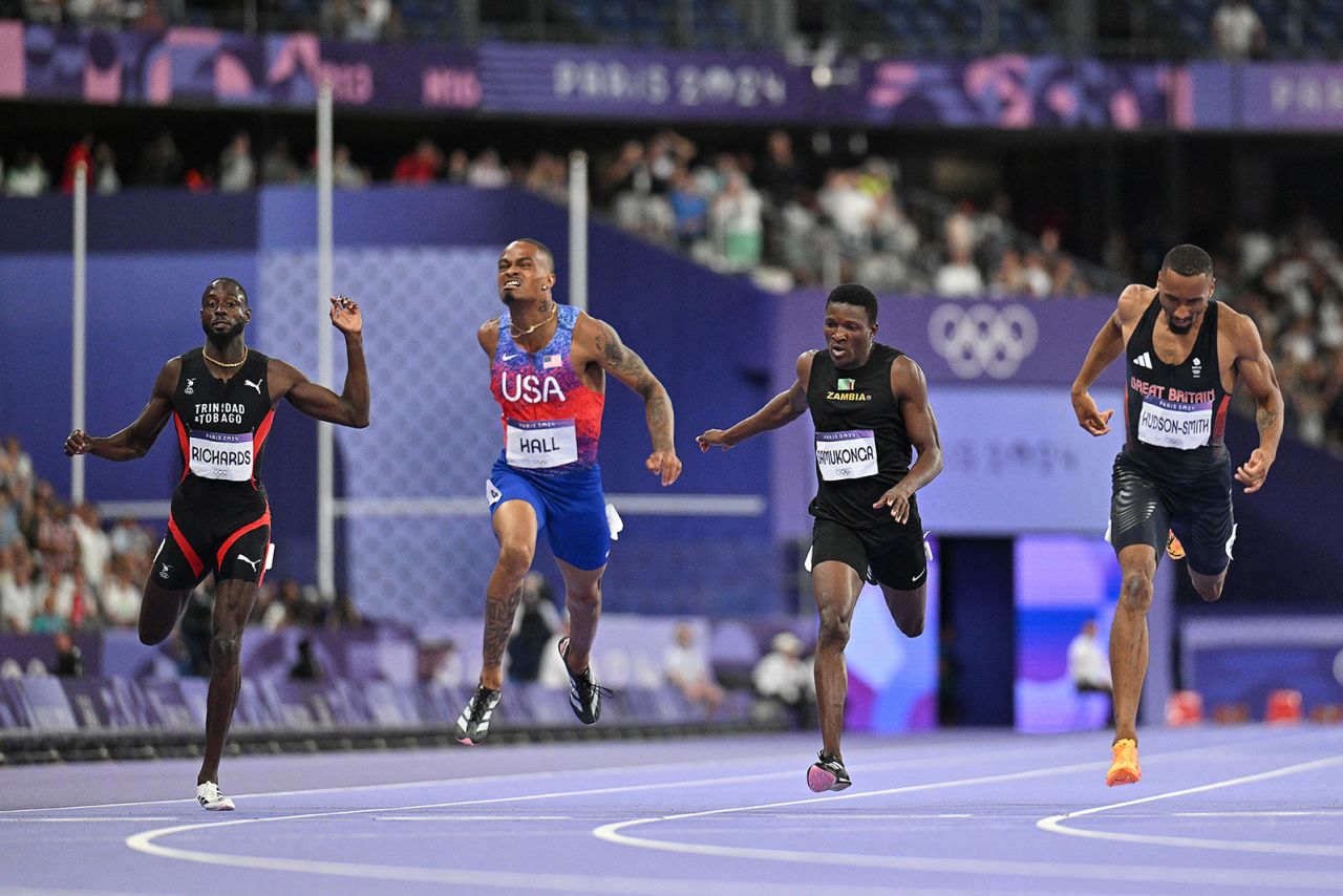 Team USA's Quincy Hall, second from left, crosses the finish line to win the men's 400m final on August 7.