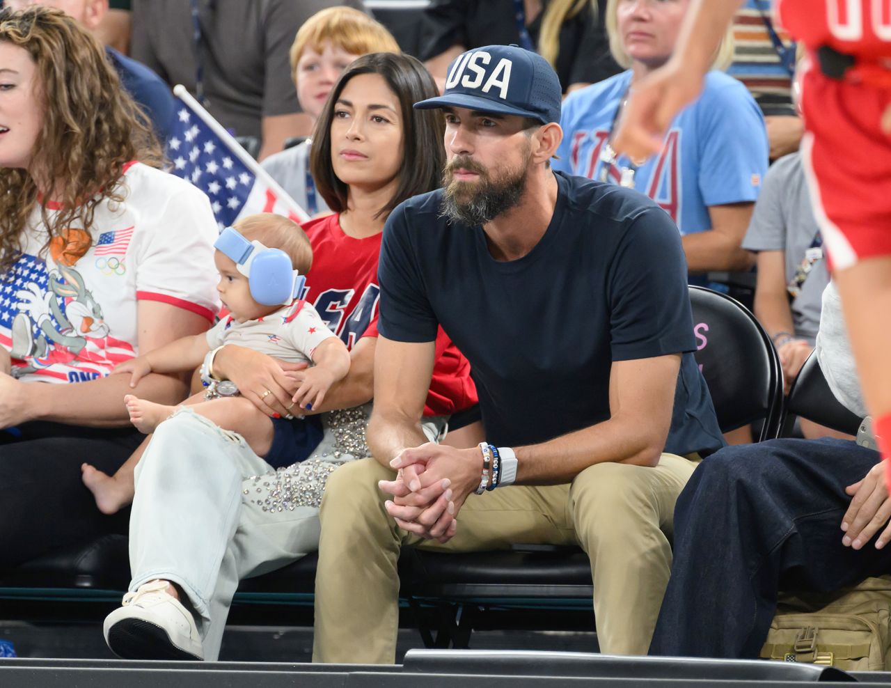 Michael Phelps and his family attend the women's basketball quarterfinal between Team USA and Nigeria at Bercy Arena on August 7.