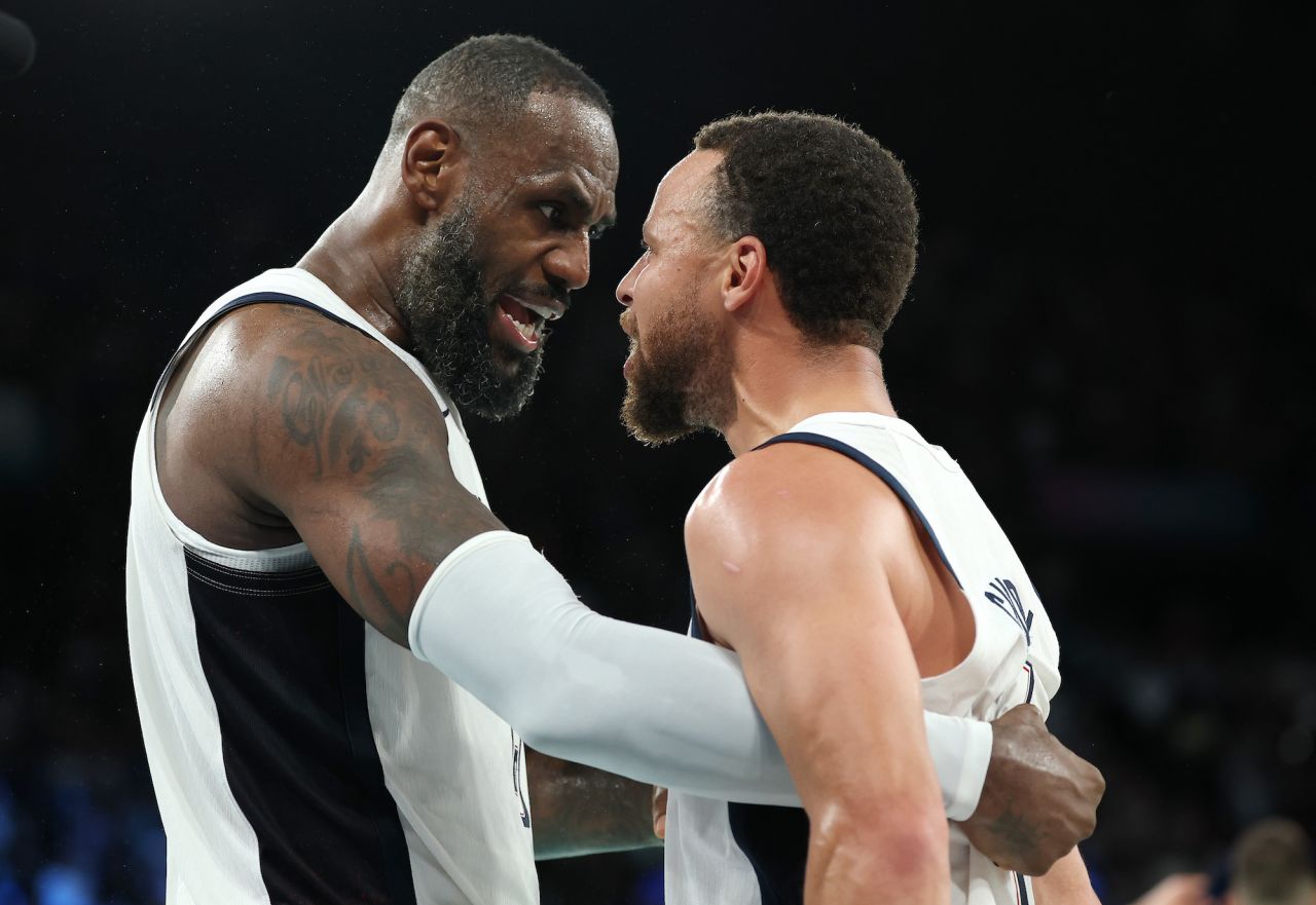 Lebron James and Stephen Curry of the United States celebrate after their team's win against Serbia during a the men's basketball semifinals match at Bercy Arena on Thursday.