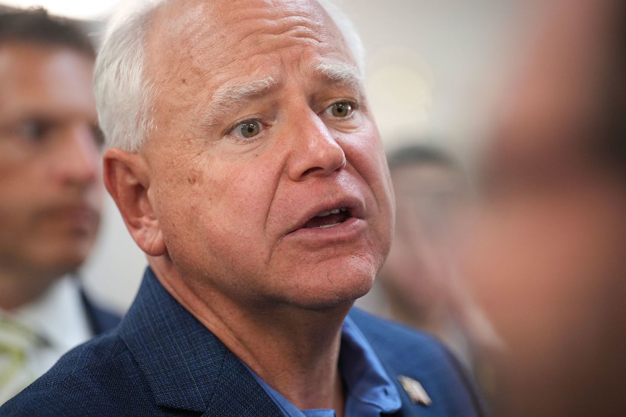 Democratic vice presidential candidate Minnesota Gov. Tim Walz speaks to audience members at a campaign rally at United Auto Workers Local 900 on Thursday, August 8, in Wayne, Michigan. 