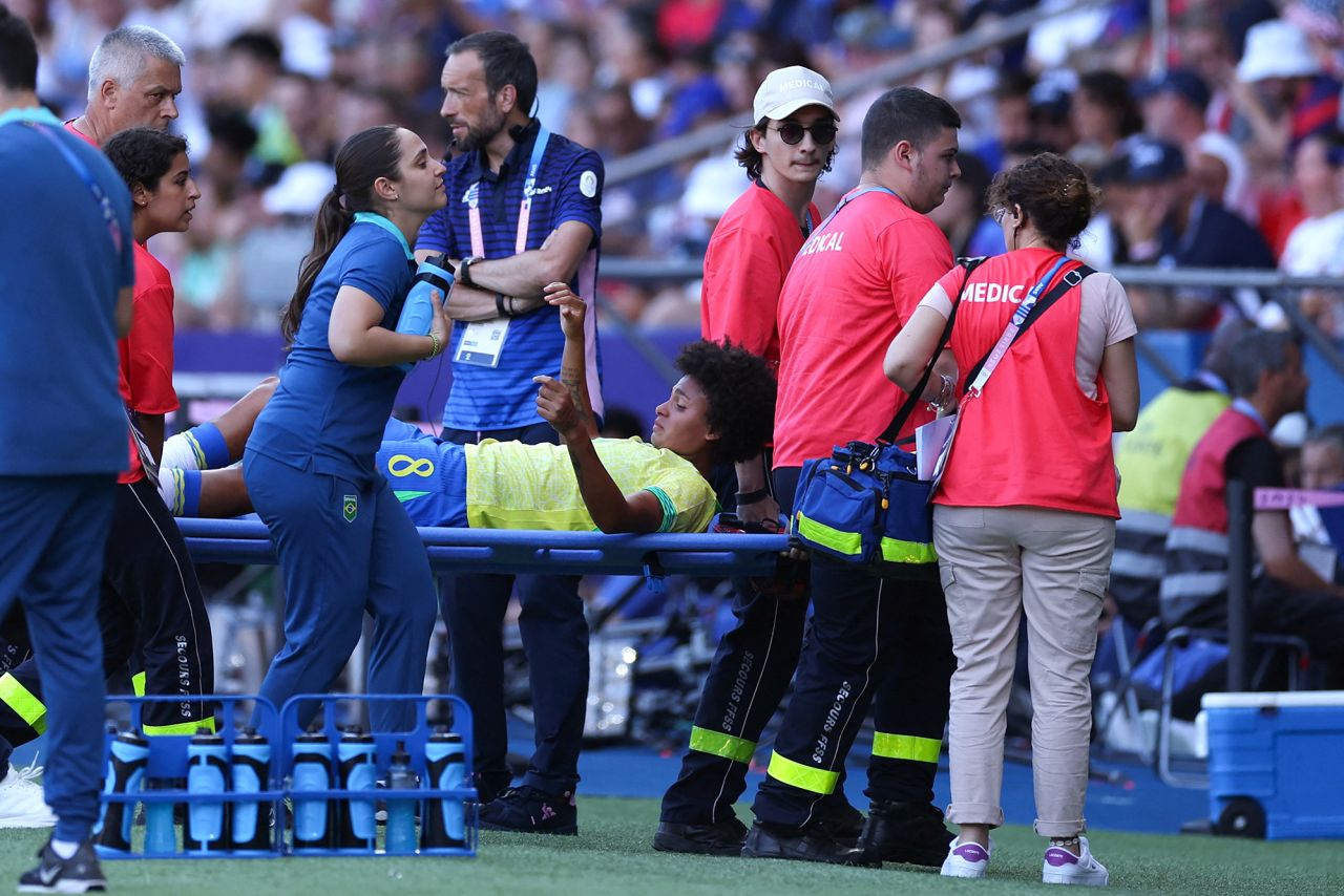 Brazil's Vitória Yaya is carried off the pitch on Saturday, August 10. 