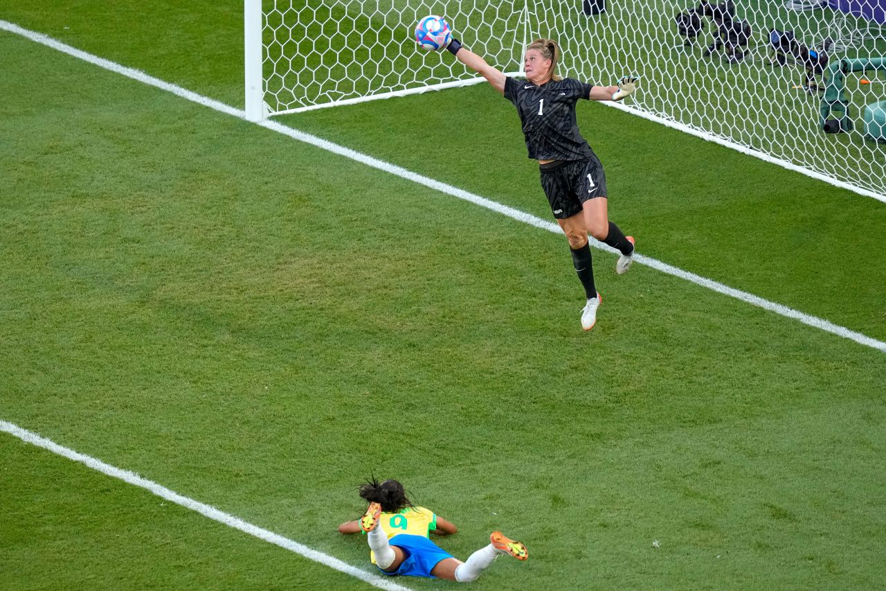 US goalkeeper Alyssa Naeher saves a header by Brazil's Adriana during the women's soccer gold medal match on August 10. 