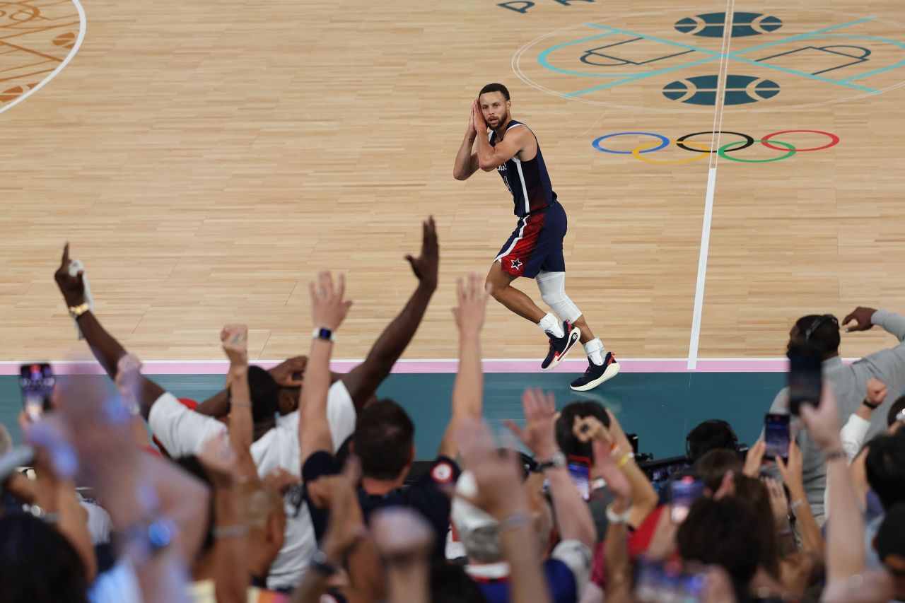 Team USA's Steph Curry celebrates after making a three-point basket in the final minutes of the gold-medal game against France on August 10.