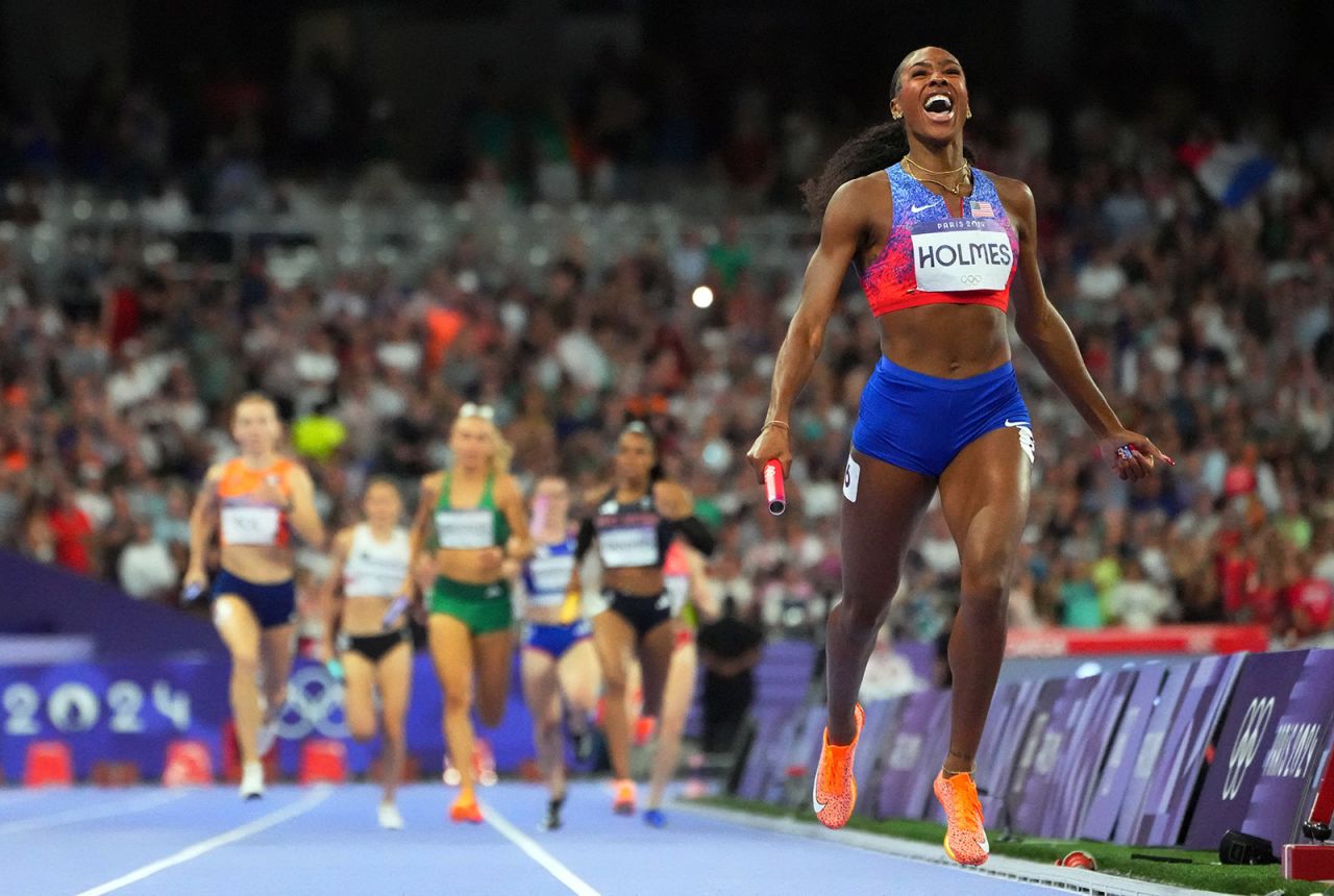 Alexis Holmes of United States crosses the line to win gold in the women's 4x400-meter relay final on August 10. 