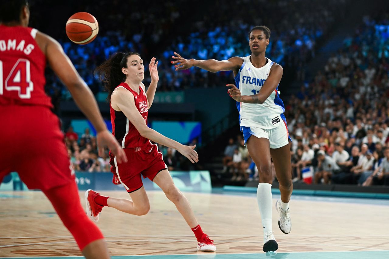 French basketball player Valériane Ayayi passes the ball during a game against the United States on August 11.