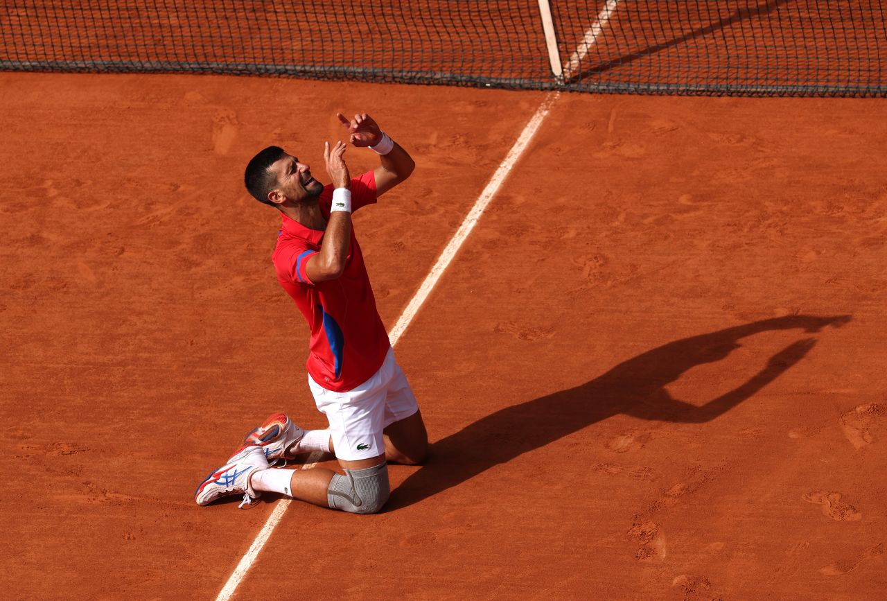 Serbian tennis player Novak Djokovic celebrates after he defeated Spain's Carlos Alcaraz to win gold on August 4.