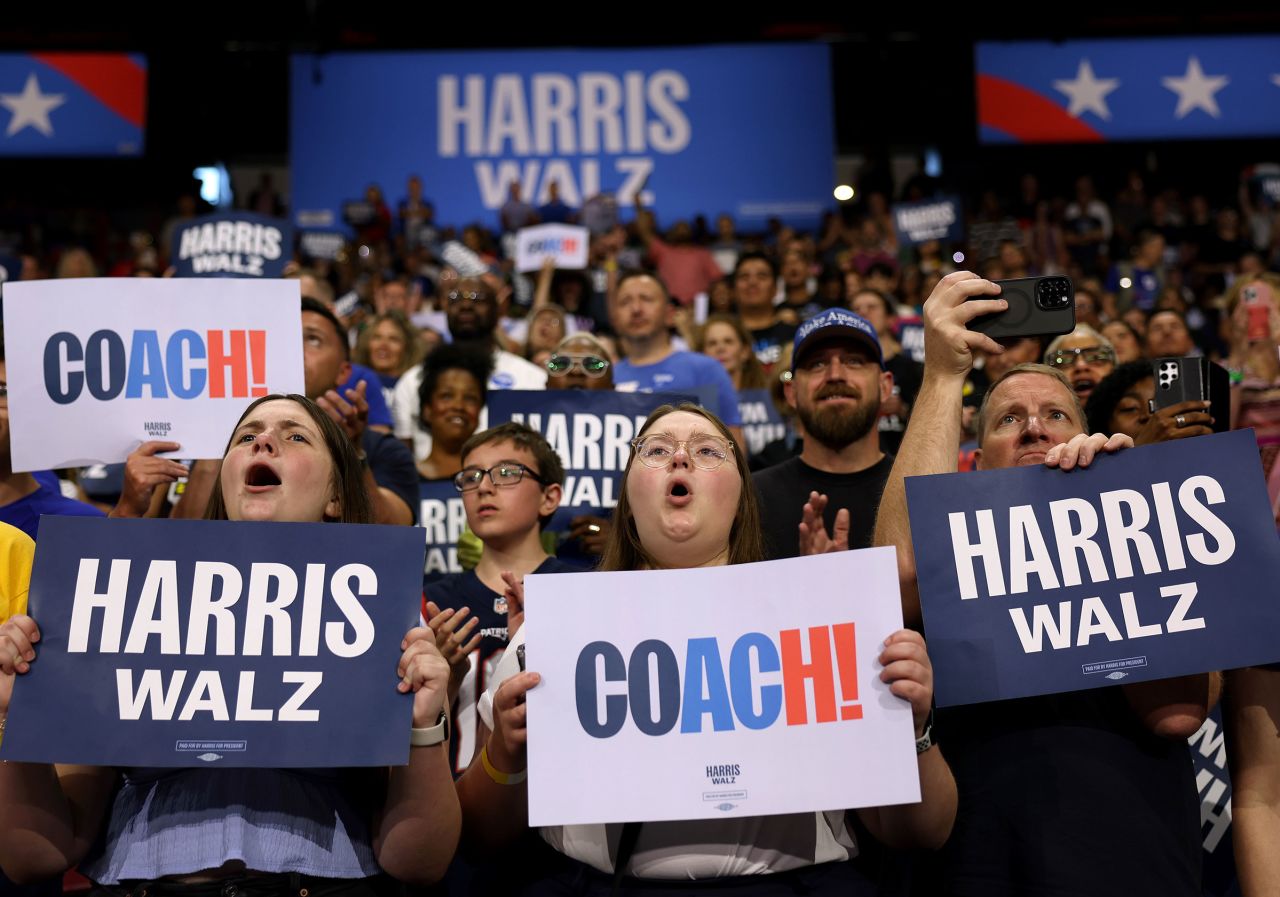 Supporters of Democratic presidential candidate Vice President Kamala Harris and Democratic vice presidential candidate Minnesota Gov. Tim Walz hold signs during a campaign rally at the University of Las Vegas Thomas & Mack Center on August 10 in Las Vegas, Nevada. 