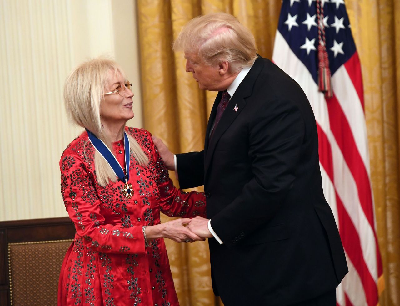 In this 2018 photo, then-President Donald Trump awards the Presidential Medal of Freedom to Doctor Miriam Adelson at the White House in Washington, DC.