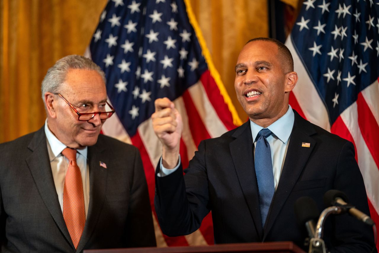 House Minority Leader Hakeem Jeffries speaks with Senate Majority Leader Chuck Schumer at a press conference on Capitol Hill in July.