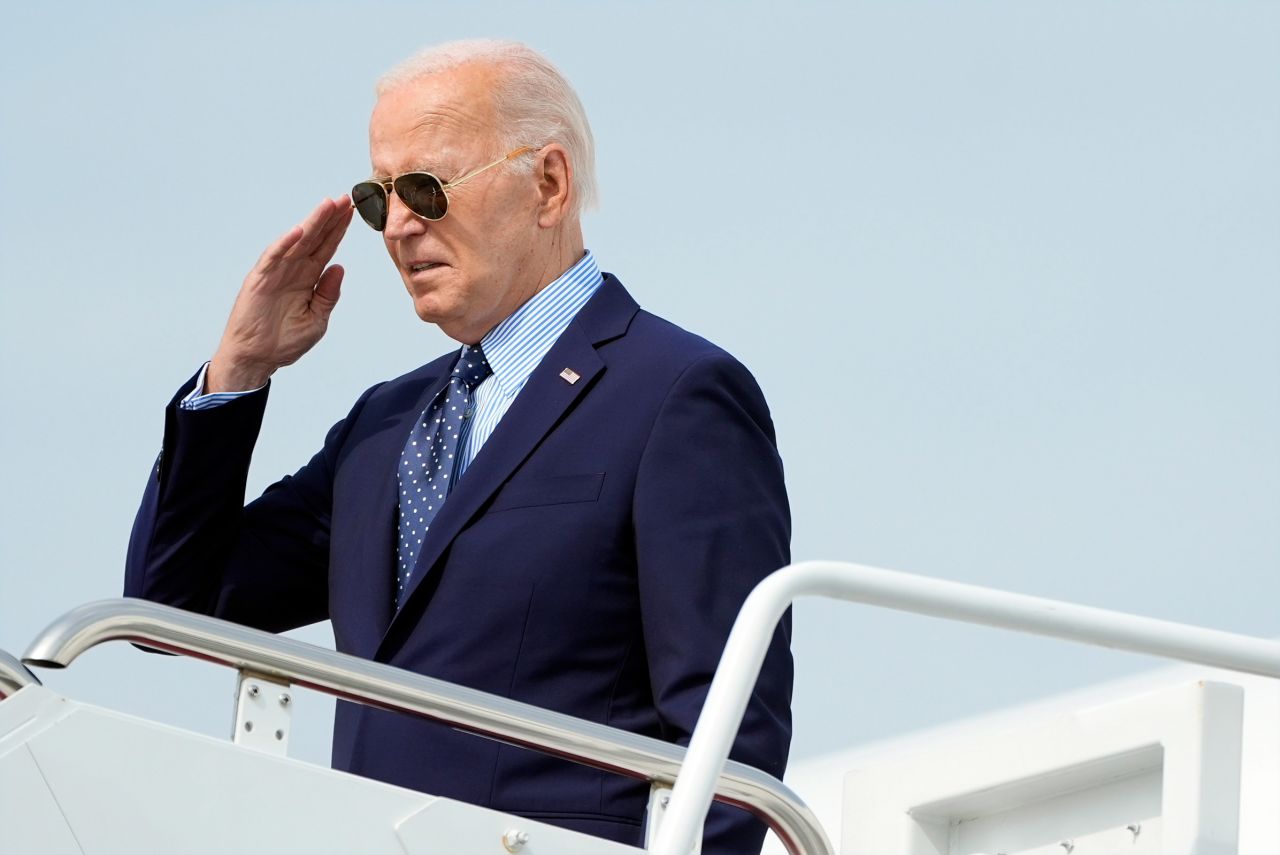 President Joe Biden salutes as he boards Air Force One at Joint Base Andrews, Maryland, on August 16.