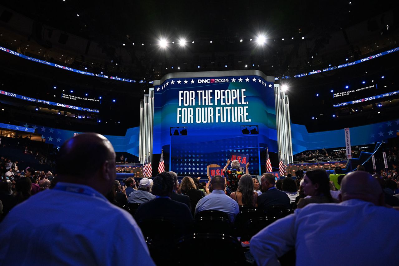 Audience members look on during the opening night of the DNC on Monday, August 19, in Chicago.