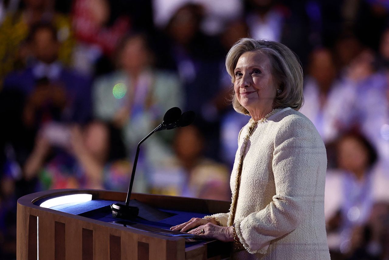 Former US Secretary of State Hillary Clinton looks on as she arrives on stage to applause on the first day of the Democratic National Convention in Chicago, on Monday, August 19.