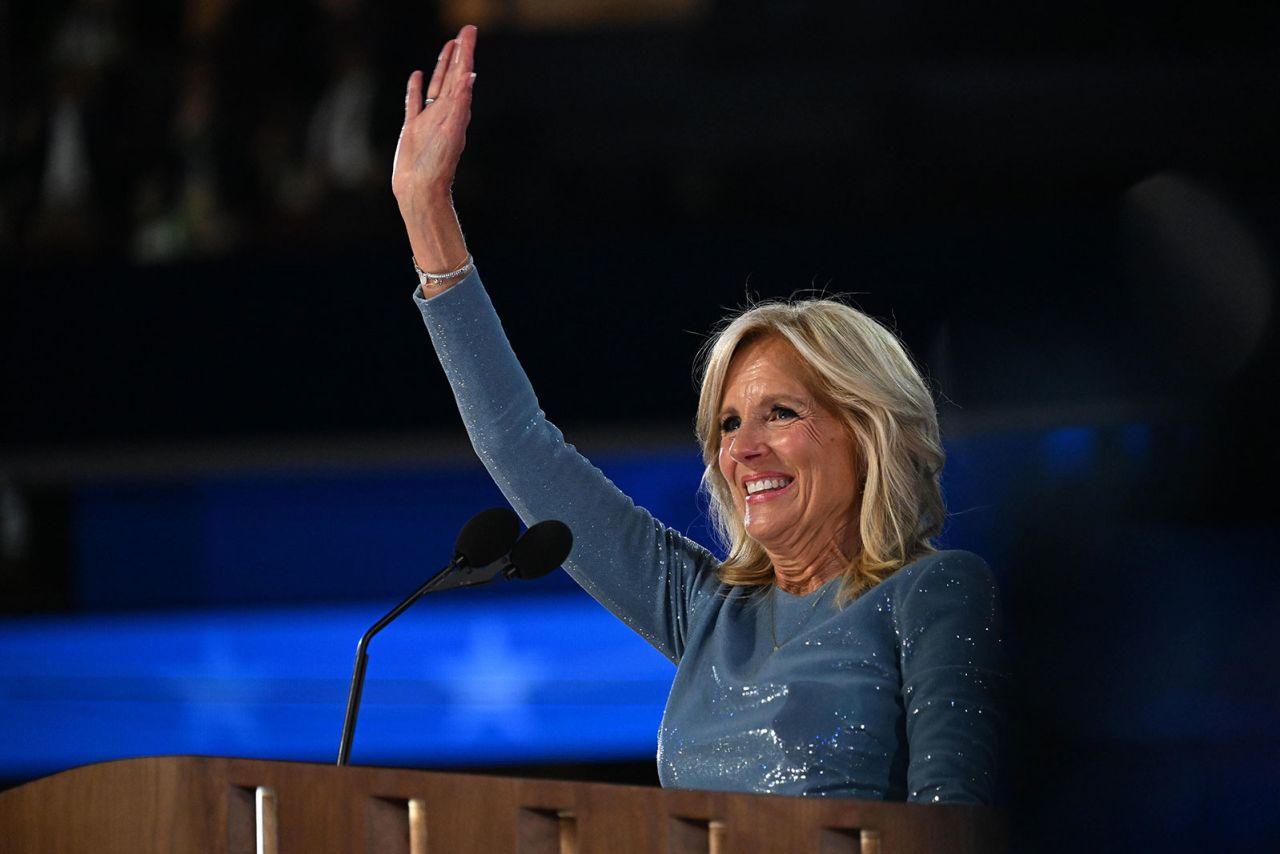 First lady Jill Biden waves from the stage on the opening night of the DNC on Monday, August 19, in Chicago.