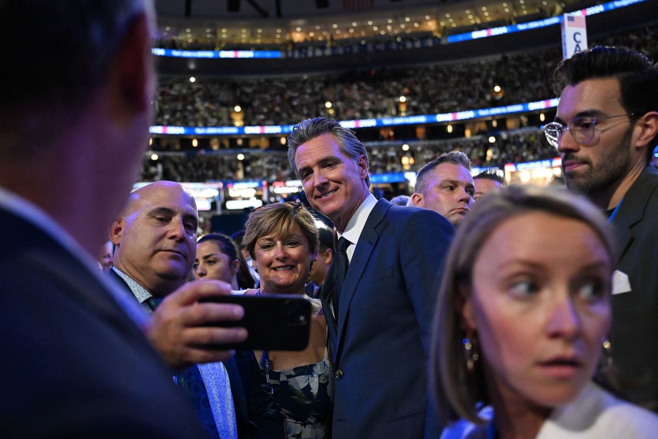 California Gov. Gavin Newsom poses for a photo during the second night of the DNC on Tuesday, August 20, in Chicago.