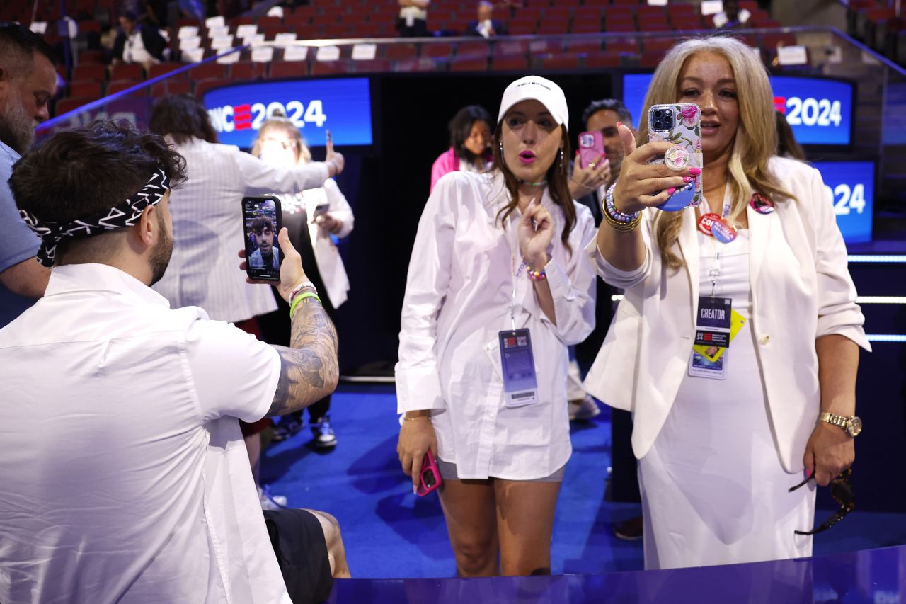 Social media influencers produce content during the final day of the Democratic National Convention (DNC) at the United Center on August 22, in Chicago.