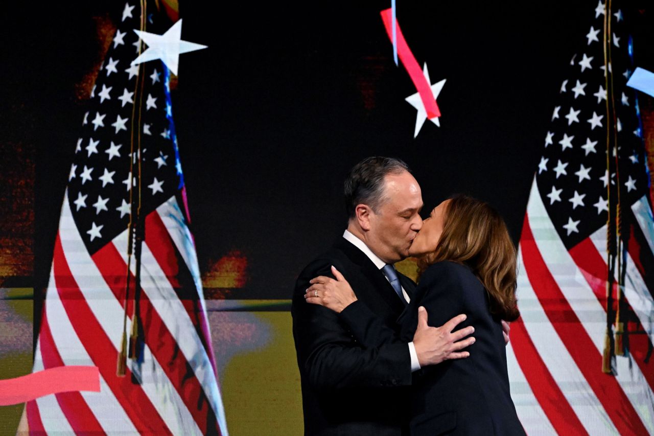 Harris kisses her husband, Doug Emhoff, after her speech. Thursday was also their 10th wedding anniversary.