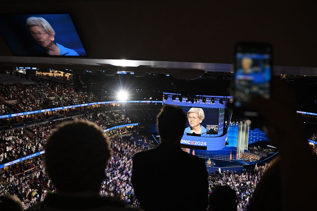 People inside the United Center watch US Sen. Elizabeth Warren speak on Thursday. 