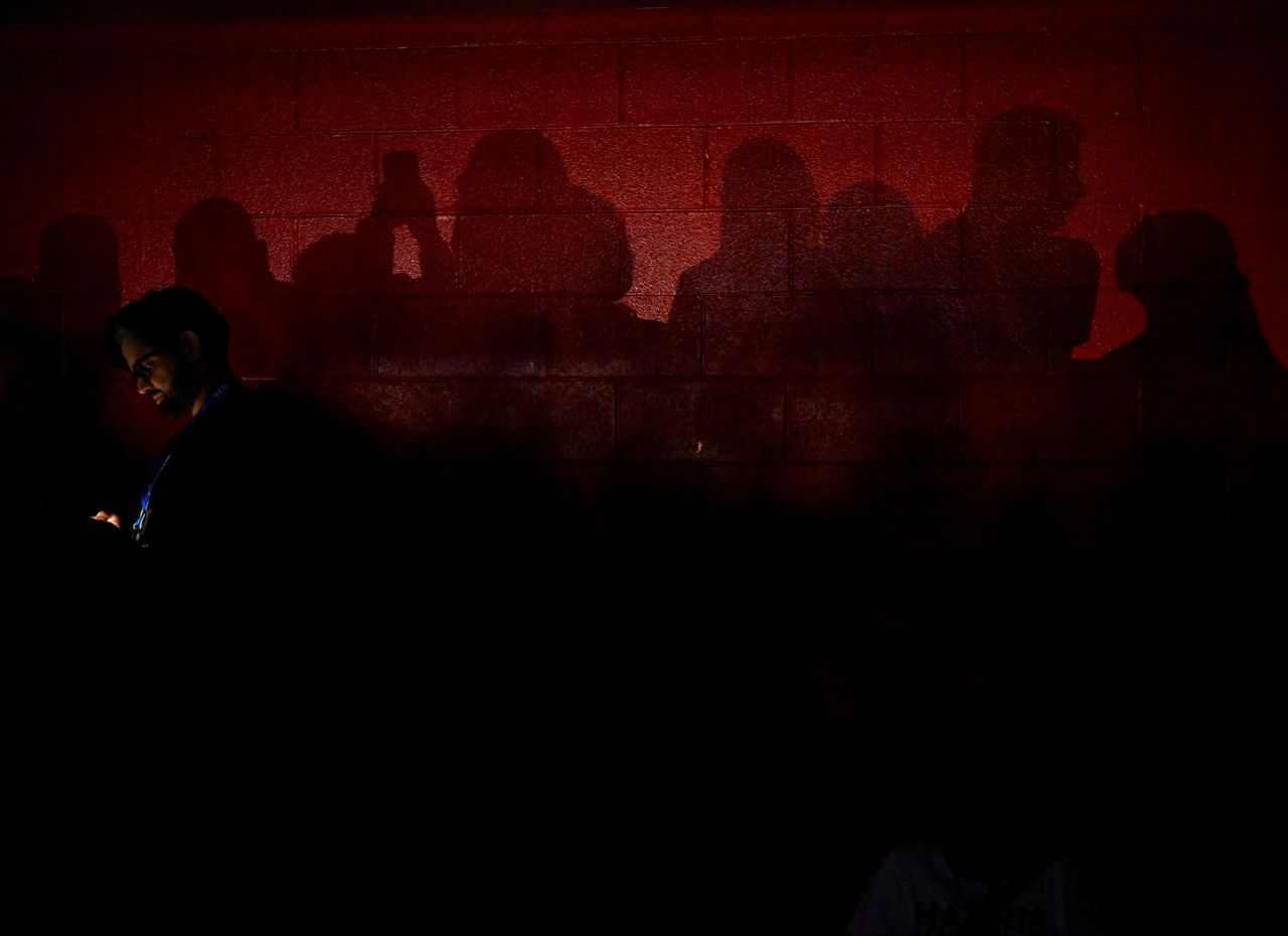 Convention attendees cast shadows on the upper level of the United Center on Thursday.