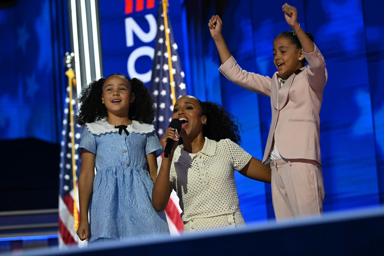 Actor Kerry Washington, center, alongside Vice President Kamala Harris’s grandnieces Leila, left, and Amara, right, lead the audience in a call-and-response chant. 