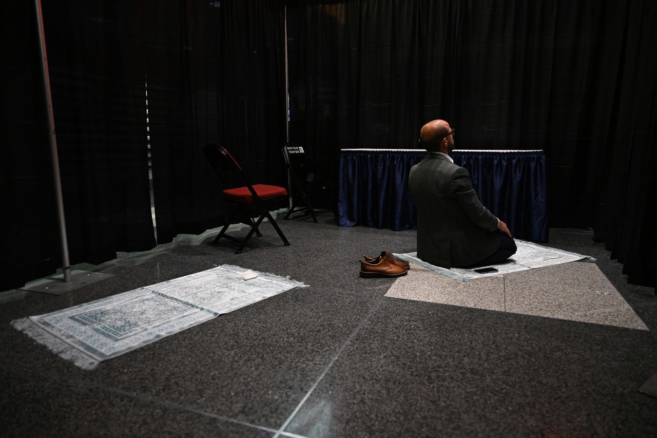 Attendee Mevlüt Hilmi Cinar prays inside the arena on Thursday.