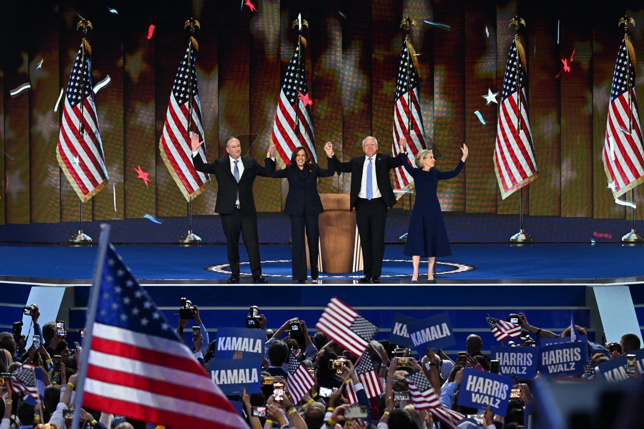 Vice President Kamala Harris and her running mate, Minnesota Gov. Tim Walz, are joined by their spouses, Doug Emhoff and Gwen Walz, after Harris' speech at the Democratic National Convention on Thursday. 