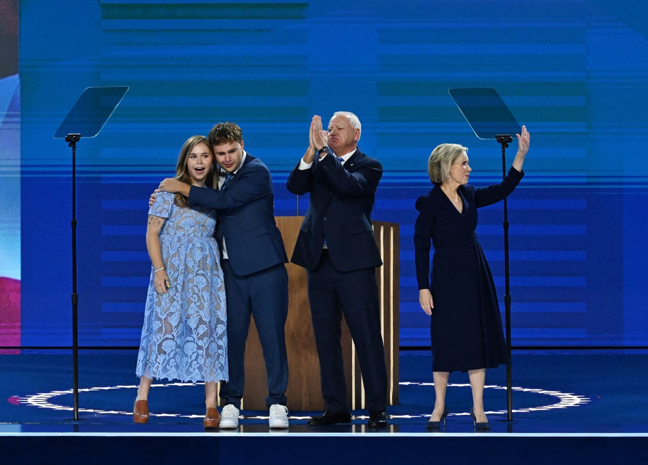 Democratic vice presidential candidate, Minnesota Gov. Tim Walz is joined onstage by his wife Gwen and their children Hope and Gus after his speech on August 21. 