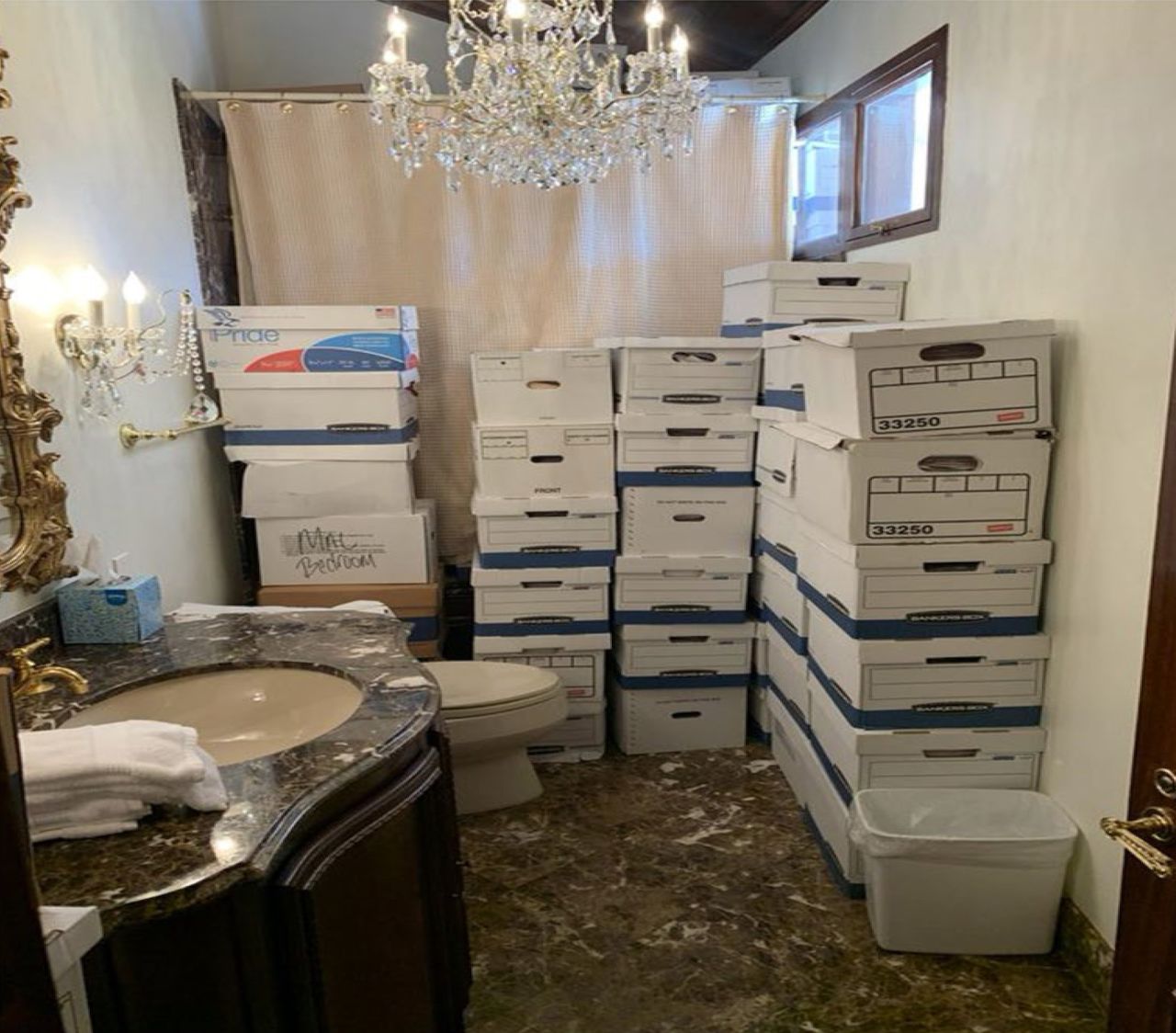 This image, contained in the indictment against former President Donald Trump, shows boxes of records stored in a bathroom and shower in the Lake Room at Trump's Mar-a-Lago estate.