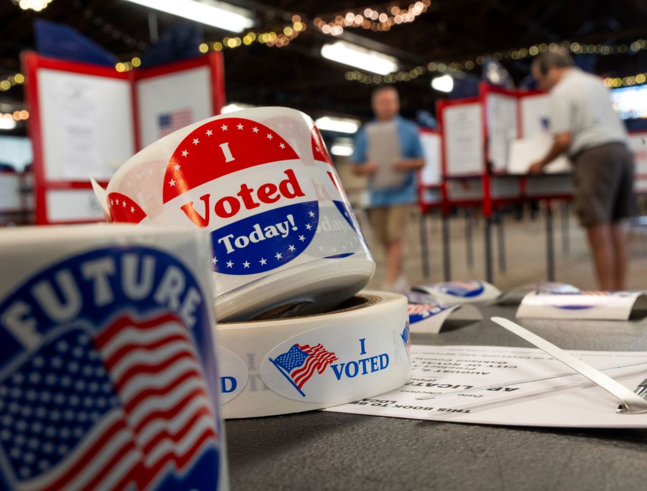 People prepare to cast their ballots in Royal Oak, Michigan, on August 6.