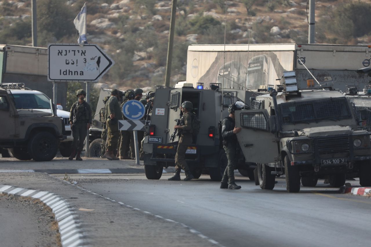 Israeli police search the area where a vehicle opened fire to an Israeli police car and killed 3 policemen at Tarqumiyah district of Hebron, West Bank on September 1.