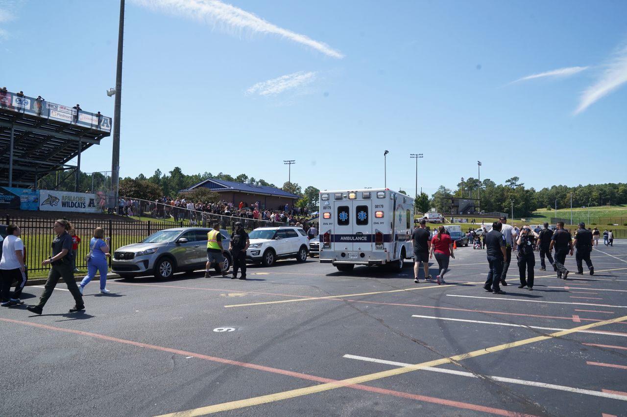 Law enforcement and first responders work as students wait to be picked up after a shooting at Apalachee High School in Winder, Georgia, on September 4.