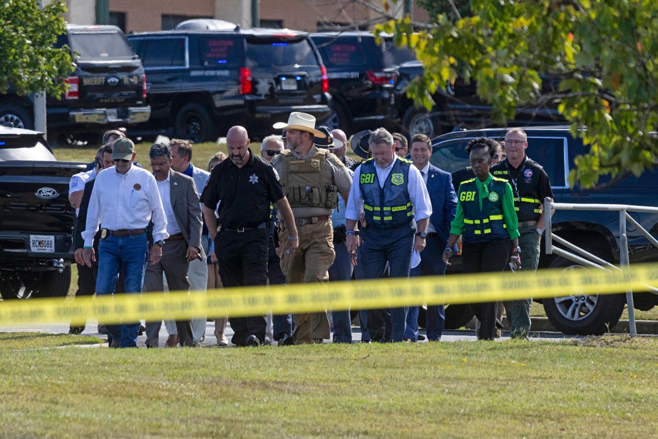 Law enforcement officials arrive to give a news conference outside of Apalachee High School in Winder, Georgia, on September 4.