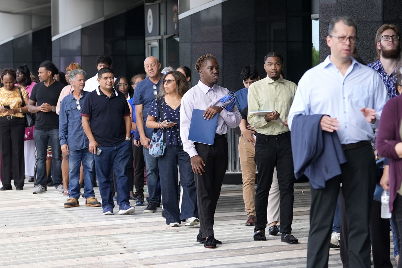 People wait in line to attend a job fair on Thursday, August 29 in Sunrise, Florida.