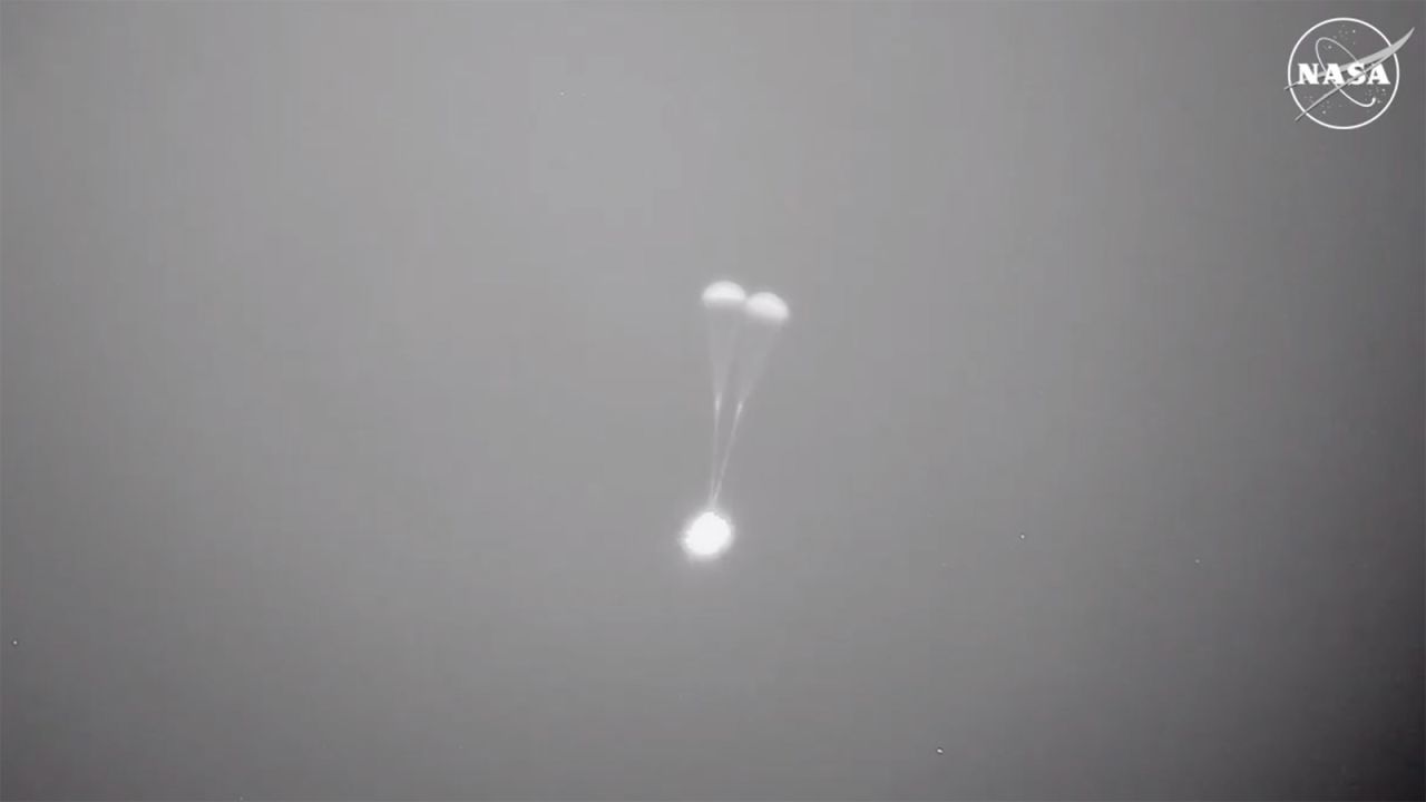 This screengrab taken from a video shows two parachutes as Boeing Starliner prepares to land. 