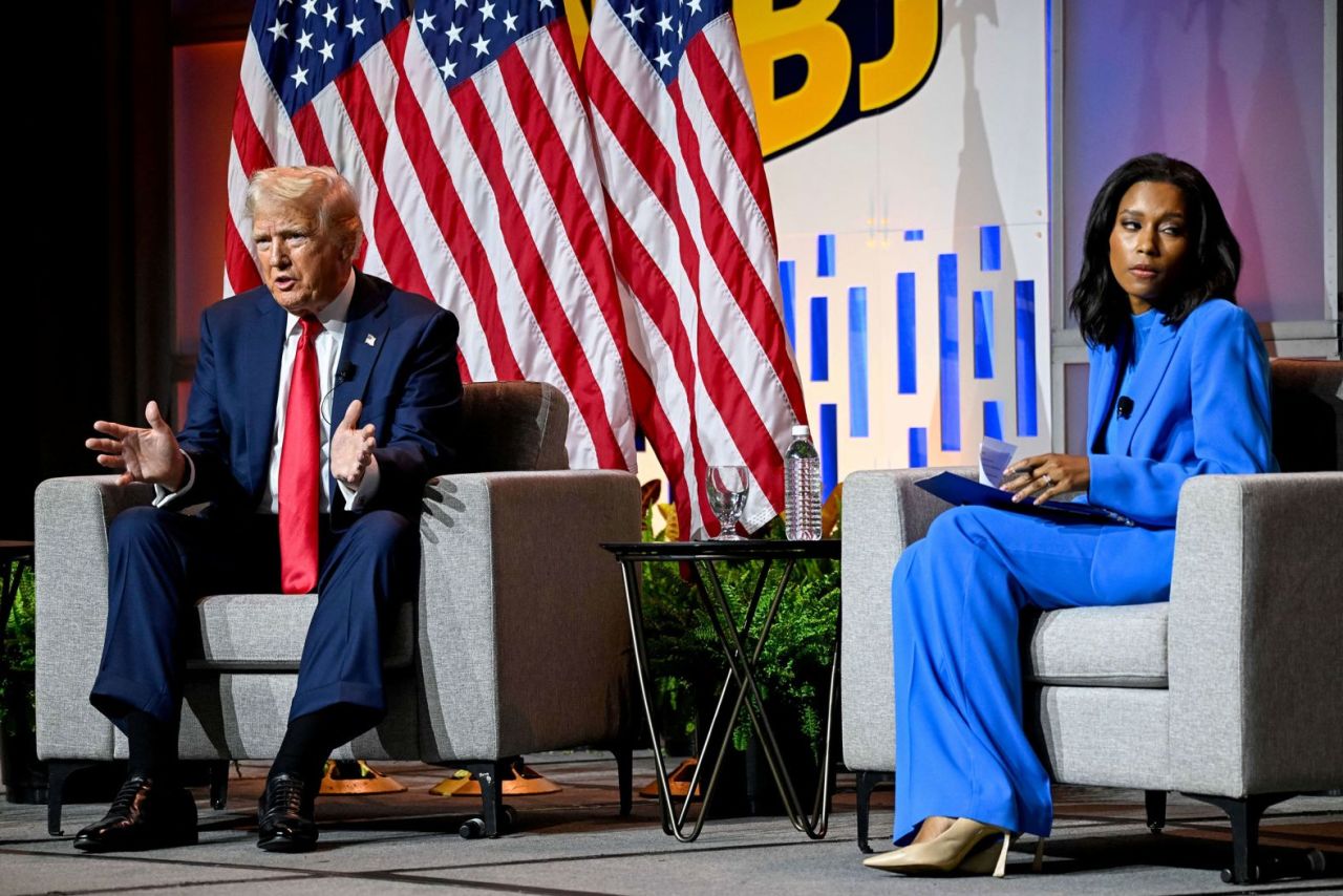 Rachel Scott, senior congressional correspondent for ABC News, looks away as Trump speaks during a Q&A session at the National Association of Black Journalists convention on July 31. Scott asked Trump why Black voters should trust him, given his past racist comments about members of Congress and political rivals like Nikki Haley and Barack Obama. Trump called it a “very nasty question” and a “rude introduction.” Later in the session, Trump falsely claimed that Vice President Harris “happened to turn Black” a few years ago. 