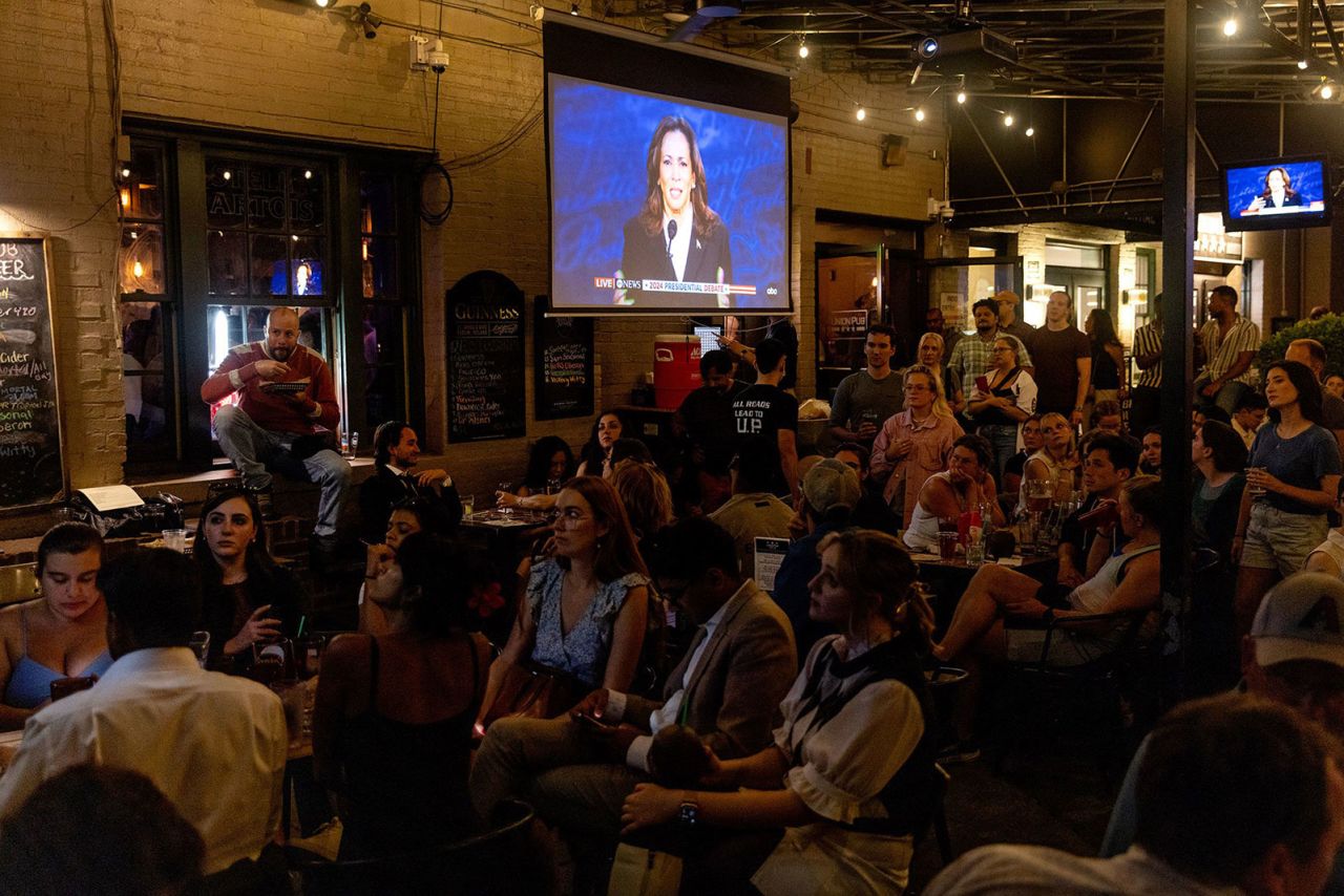 Patrons watch the ABC presidential debate between former President Donald Trump and Vice President Kamala Harris, during a watch party at Union Pub in Washington, DC on Tuesday, September 10.