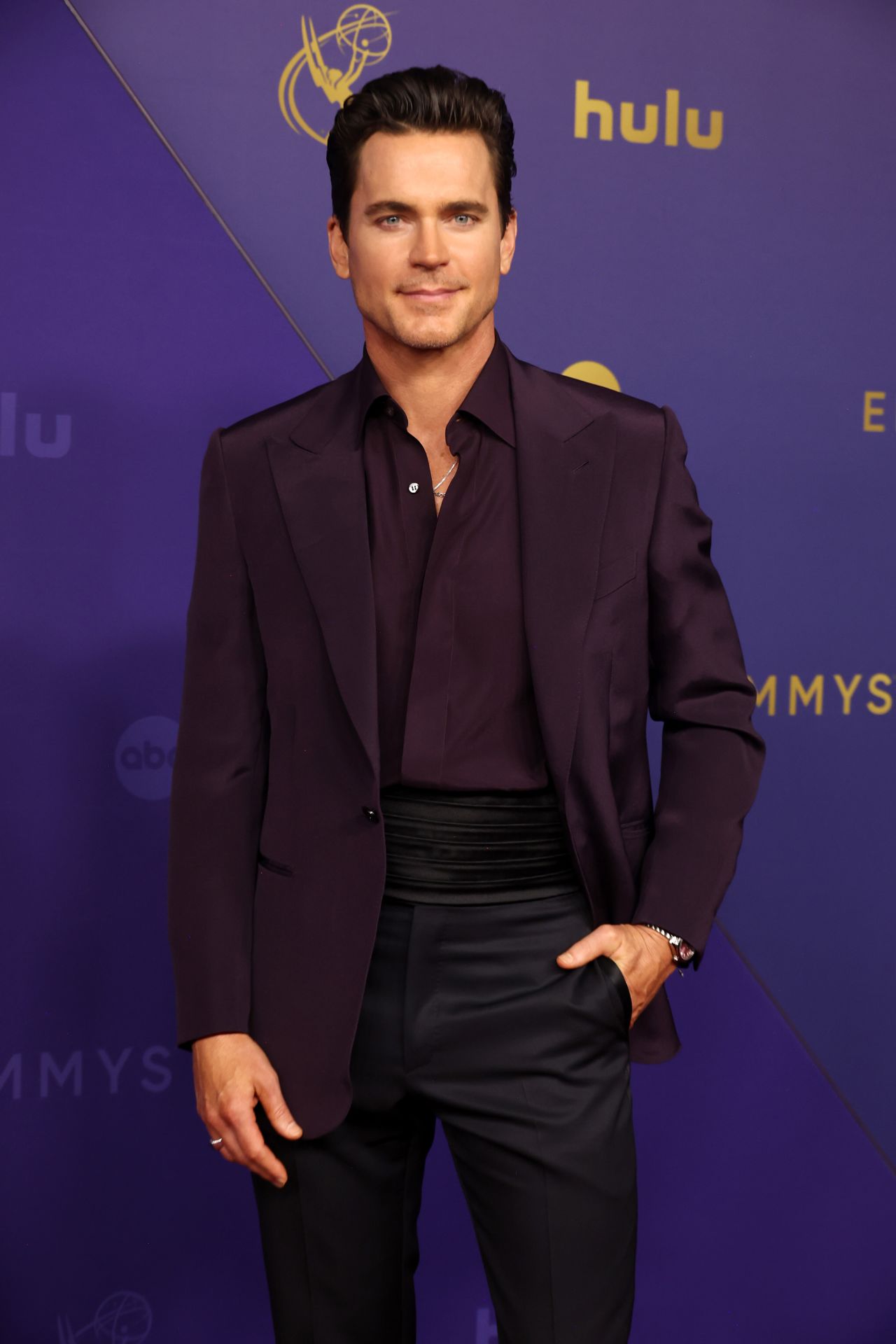 Bomer attends the Emmys red carpet. 