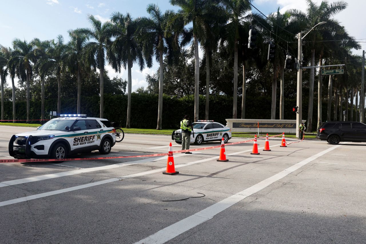 Police vehicles are parked after shots were fired outside the Trump International Golf Club in West Palm Beach, Florida on Sunday. 