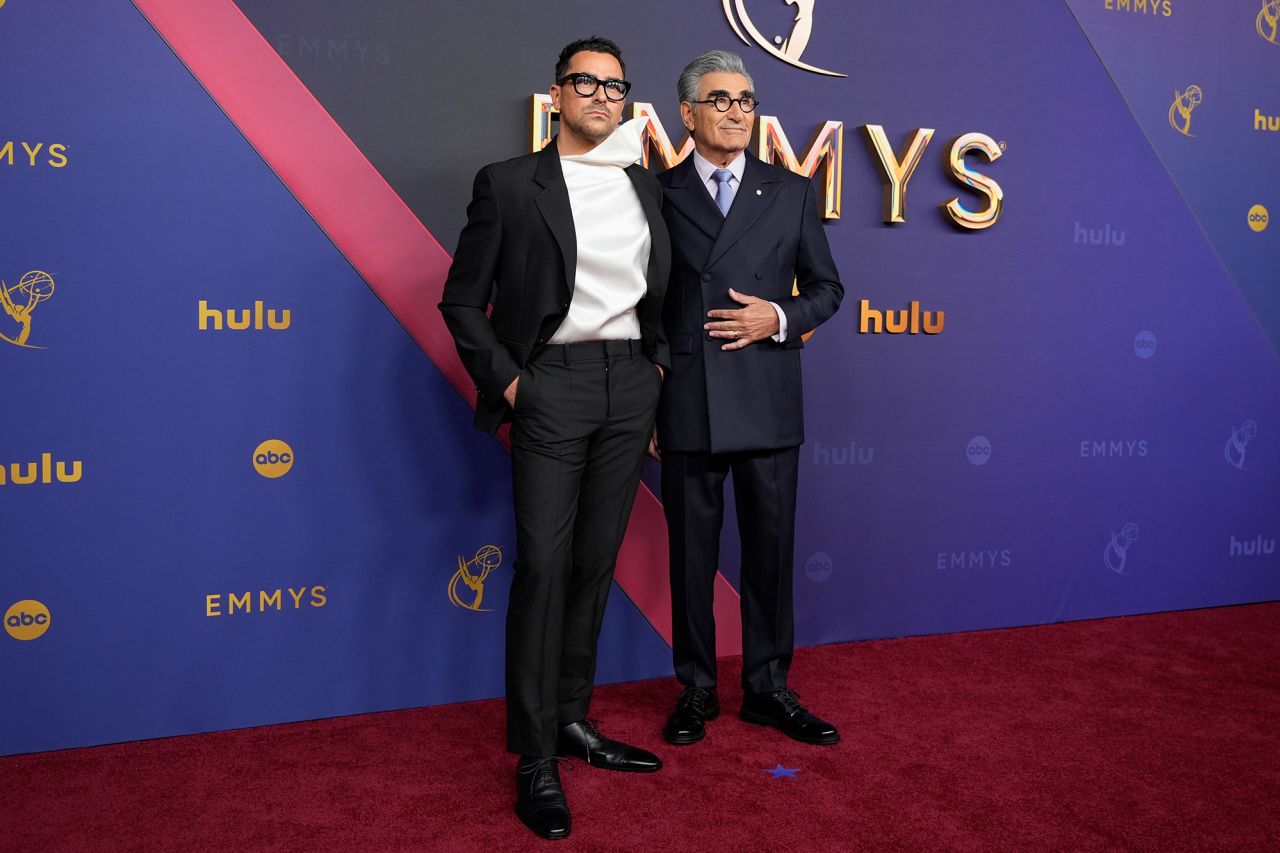 Hosts Dan Levy, left, and Eugene Levy arrive at the Emmy Awards on September 15 in Los Angeles. 