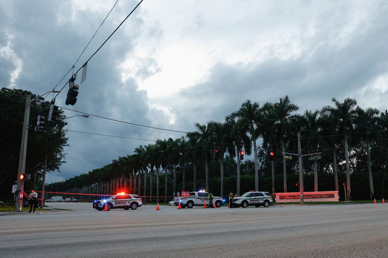 Law enforcement officers block a road after reports of shots fired at Republican presidential nominee and former U.S. President Donald Trump's Trump International Golf Club in West Palm Beach, Florida, on September 15.