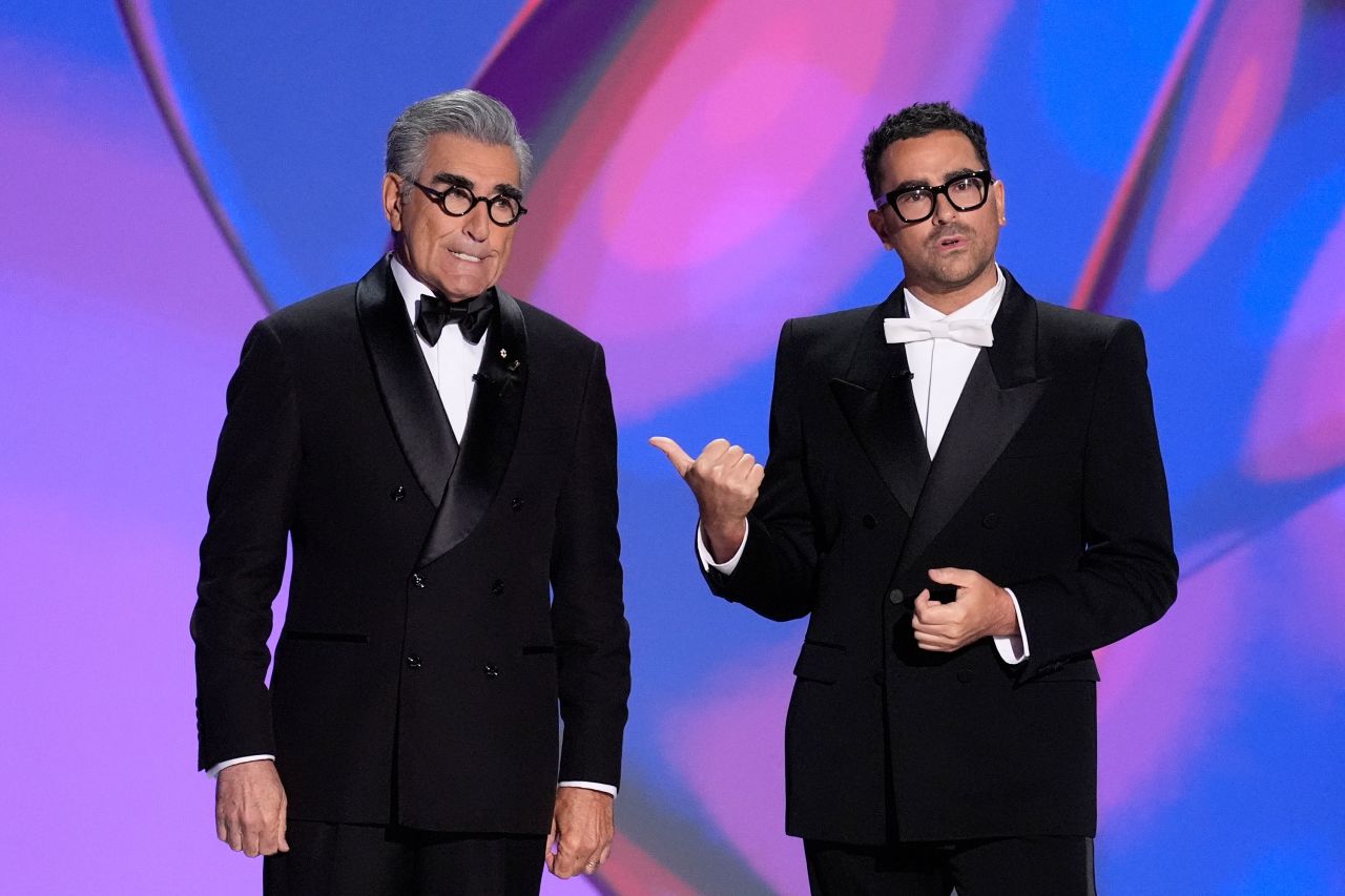 Hosts Eugene and Dan Levy speak during the Emmy Awards on September 15 in Los Angeles. 