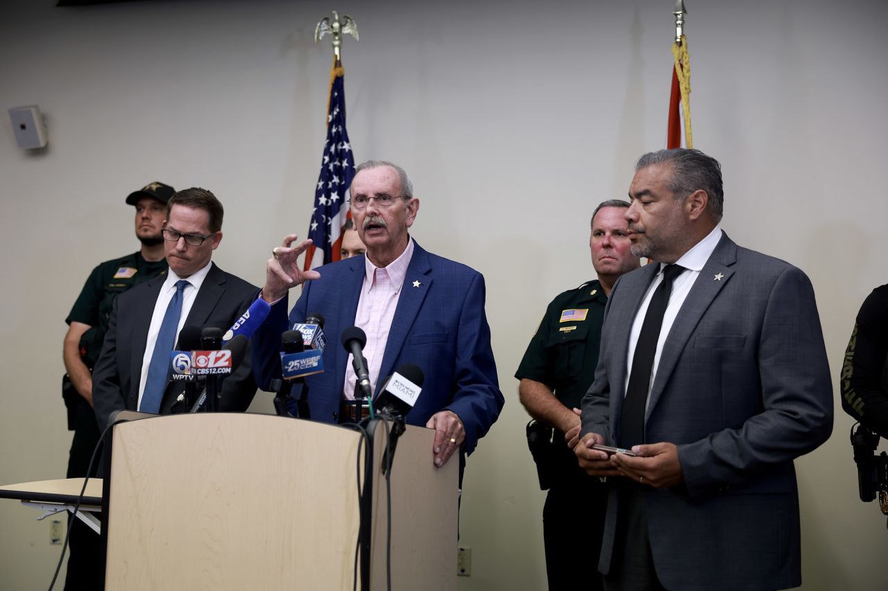 Jeffrey Veltri, left, special agent in charge of the FBI's Miami Field Office, Palm Beach County Sheriff Ric Bradshaw, center, and Rafael Barros, right, special agent in charge of the US Secret Service's Miami field office, attend a news conference regarding an apparent assassination attempt of former President Donald Trump on September 15, in West Palm Beach, Florida.