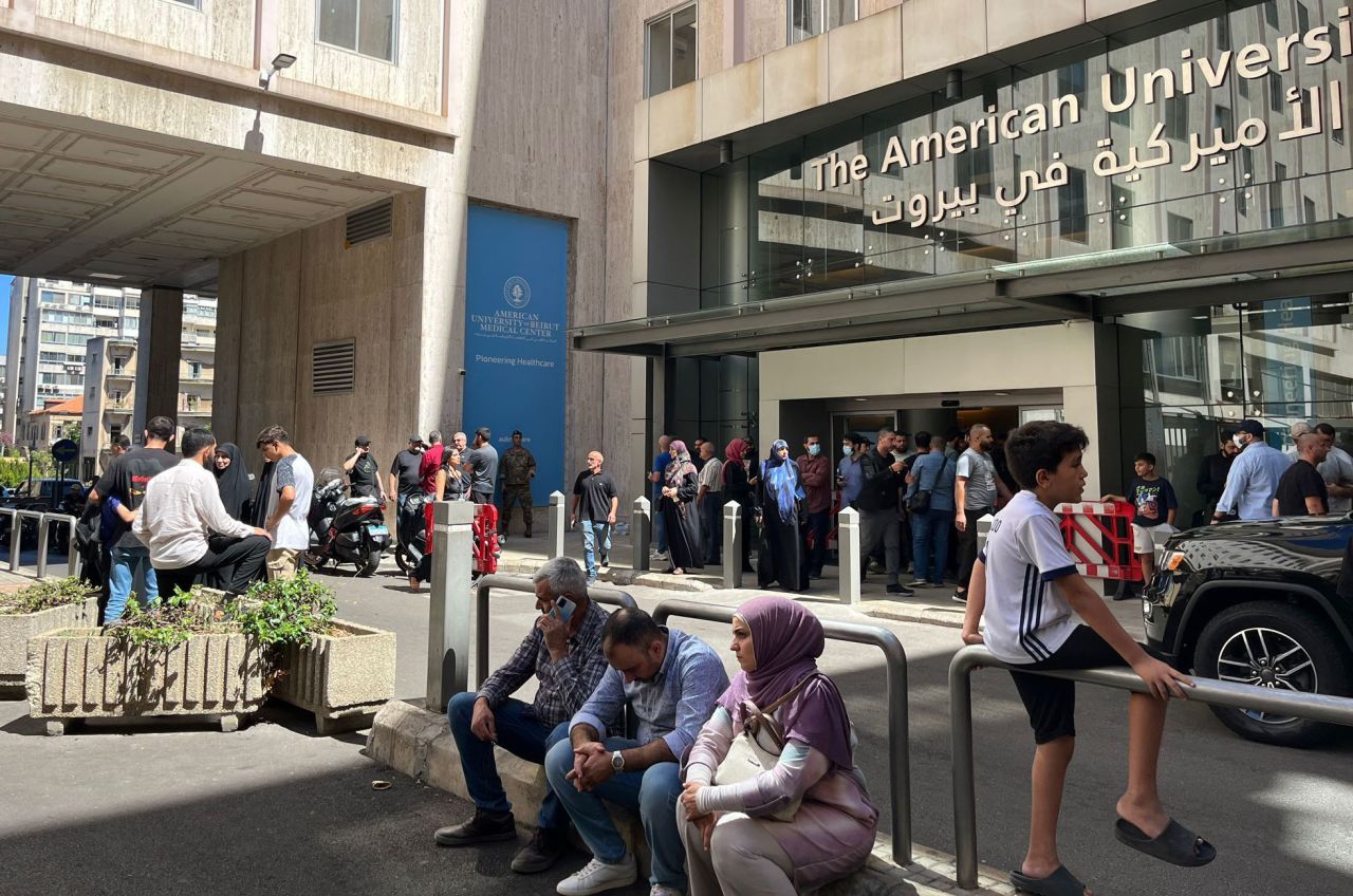 People gather outside the American University of Beirut Hospital, on September 18, after exploding pagers left at least 2,800 wounded and killed nine.