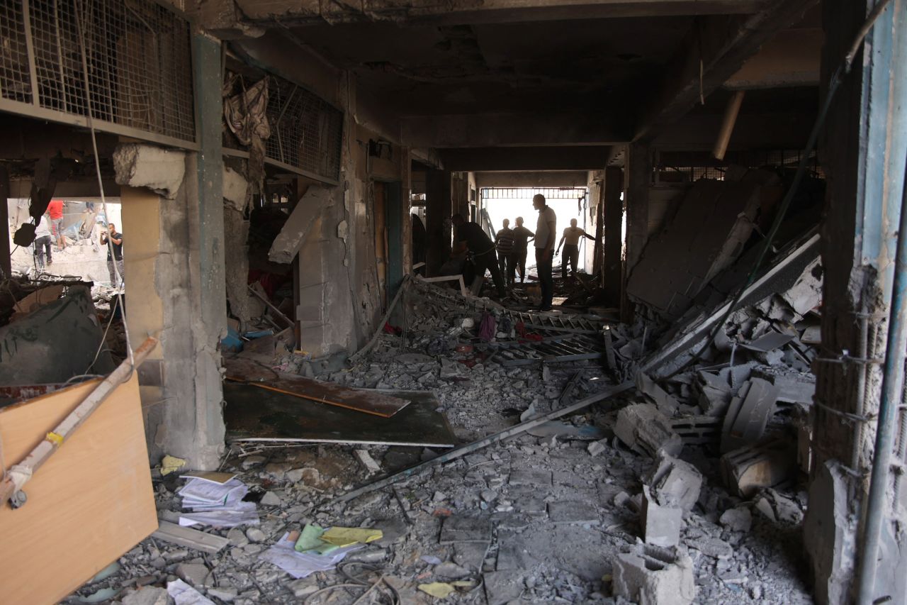 Palestinians inspect the damage at the site of an Israeli strike on a school in Gaza City's Al-Zaytoun neighborhood on September 21.?